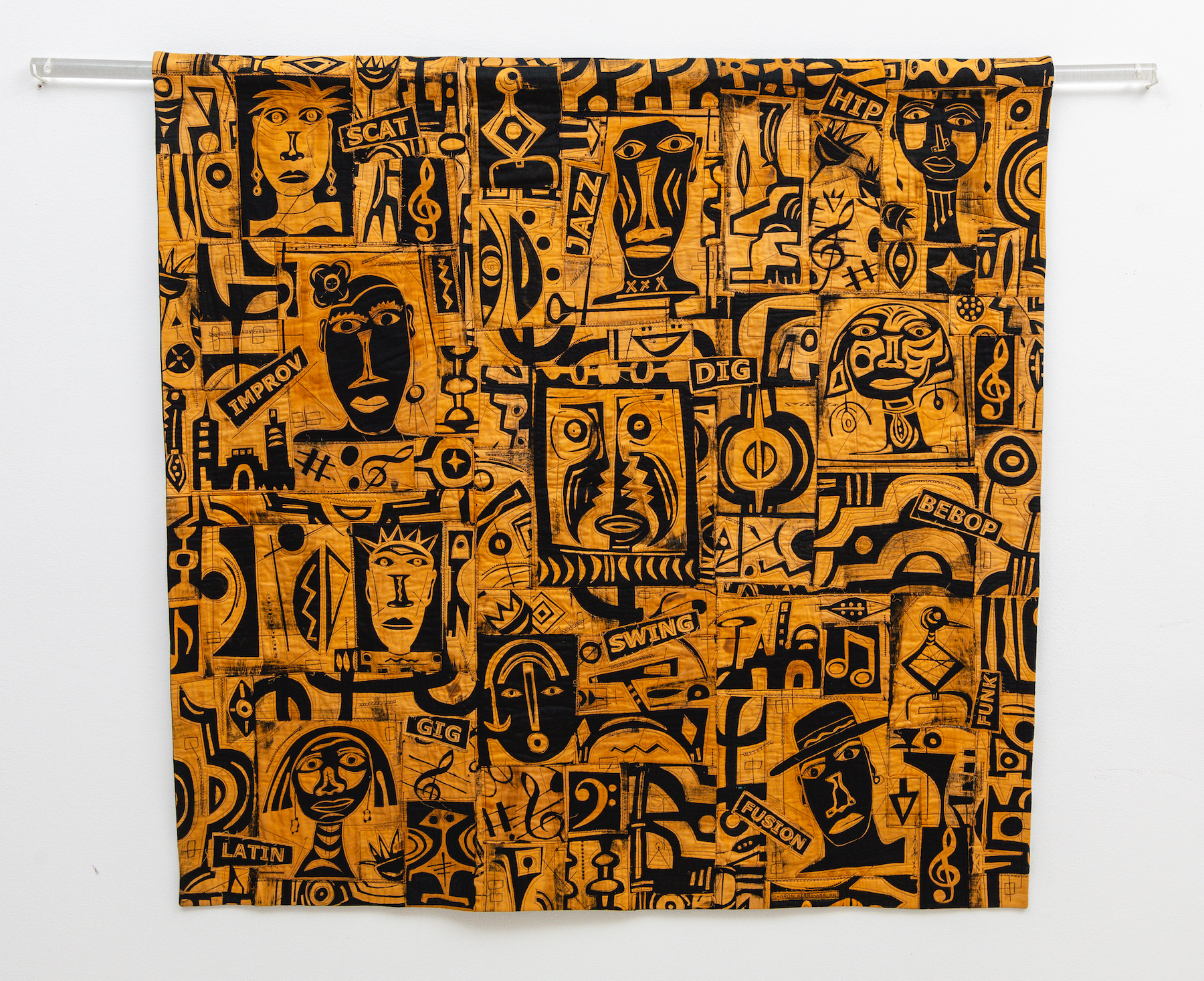 Kerry Harlan Straight No Chaser Many figures and musical notation are spread throughout this tapestry. There are only two colors, an earthy gold and black. There are many small texts each referring to different styles of music.